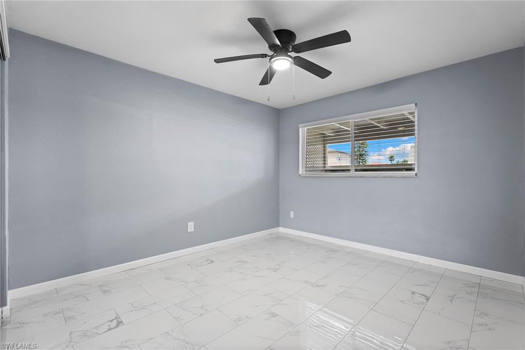 14929 Wise Way, Unit 931 Fort Myers, FL 33905 - Photo 22 of 39 an empty room with a window and a fan