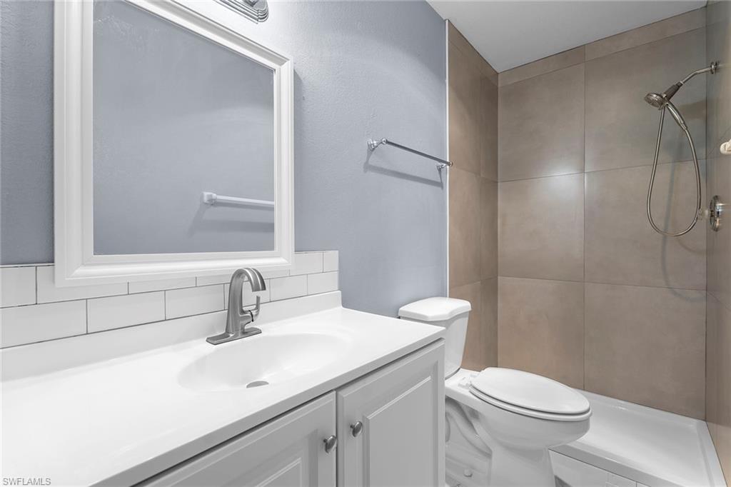14929 Wise Way, Unit 931 Fort Myers, FL 33905 - Photo 24 of 39 a bathroom with a sink a toilet and shower