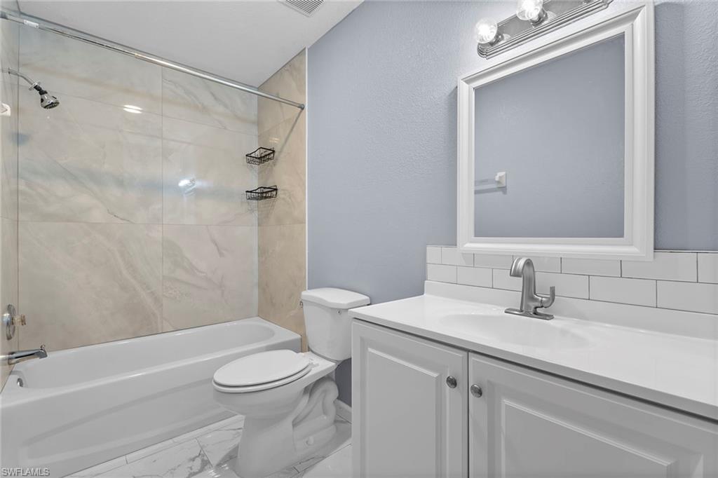 14929 Wise Way, Unit 931 Fort Myers, FL 33905 - Photo 25 of 39 a bathroom with a sink a toilet and shower