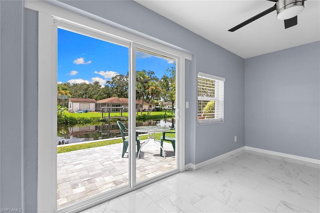 14929 Wise Way, Unit 931 Fort Myers, FL 33905 - Photo 27 of 39 a view of a big room with yard wooden floor and windows