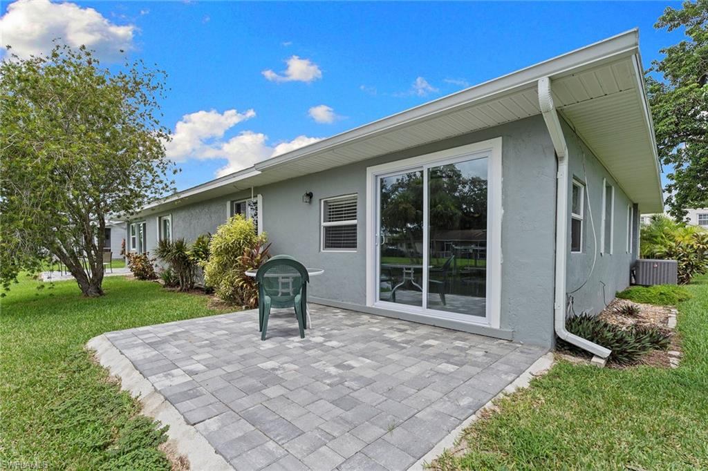 14929 Wise Way, Unit 931 Fort Myers, FL 33905 - Photo 28 of 39 front view of a house with a yard