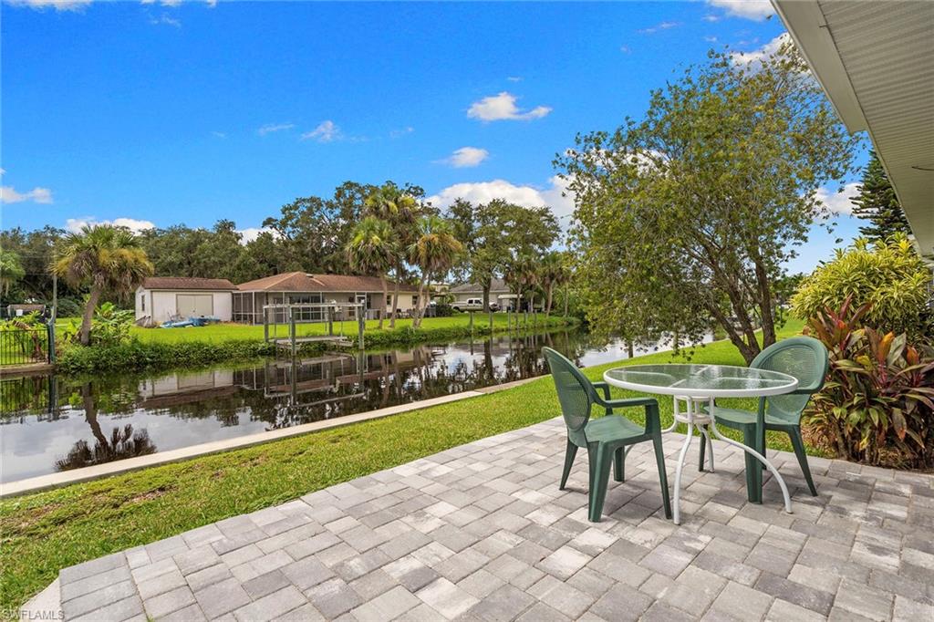 14929 Wise Way, Unit 931 Fort Myers, FL 33905 - Photo 29 of 39 a swimming pool with outdoor seating and yard
