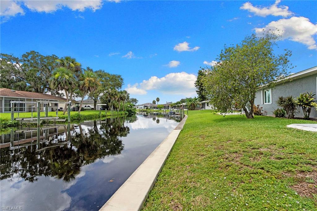 14929 Wise Way, Unit 931 Fort Myers, FL 33905 - Photo 30 of 39 a view of a garden with a fountain and a yard