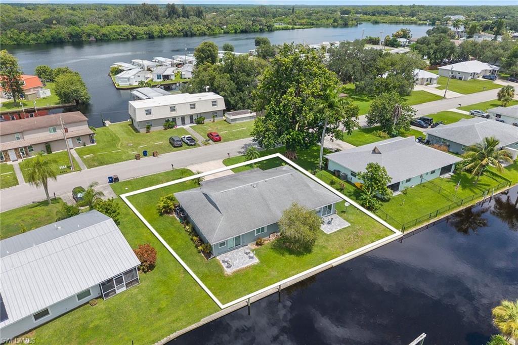 14929 Wise Way, Unit 931 Fort Myers, FL 33905 - Photo 37 of 39 an aerial view of a house with a lake view