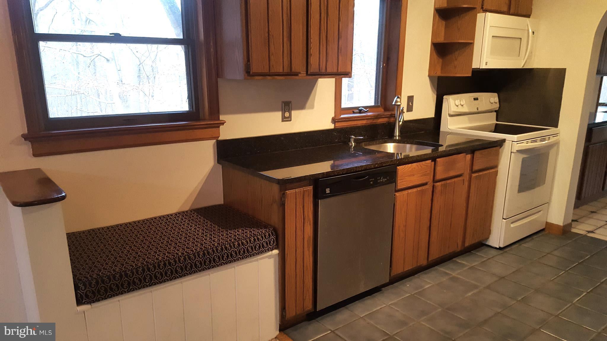 4281 Sixes Road Prince Frederick, MD 20678 - Photo 6 of 18 Granite and a storage bench