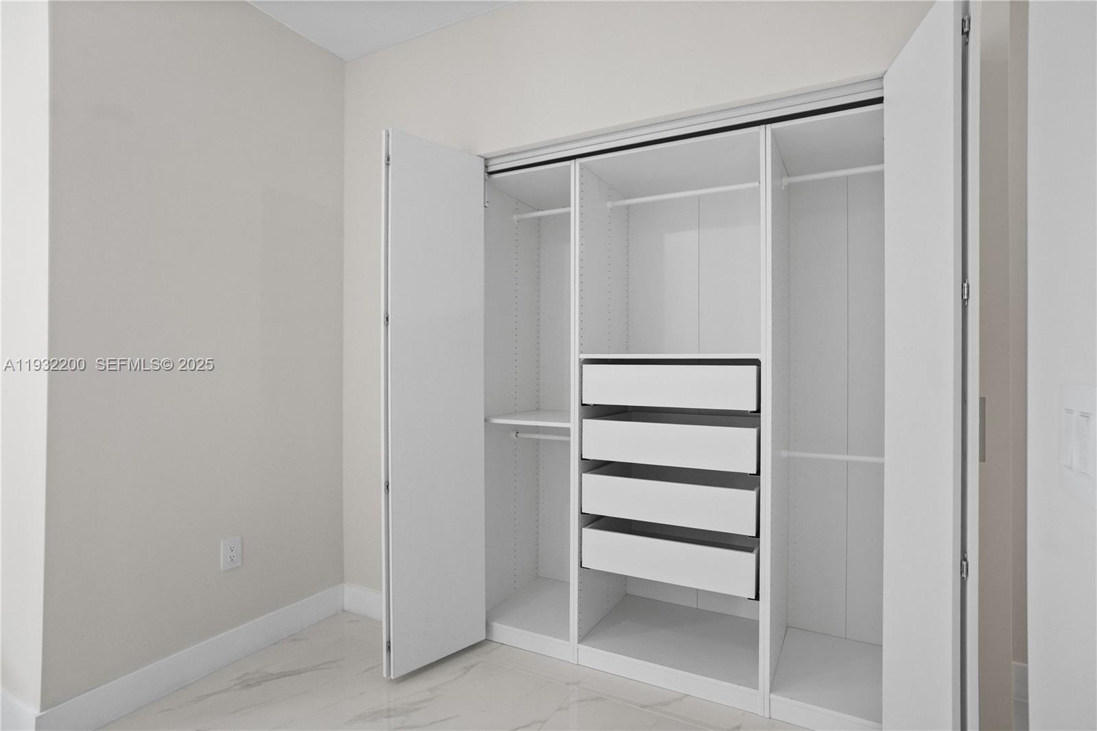700 Northeast 24th Street, Unit 602 Miami, FL 33137 - Photo 15 of 39 a view of an empty walk in closet