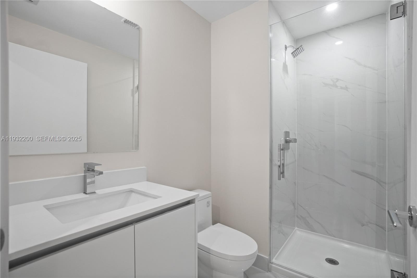 700 Northeast 24th Street, Unit 602 Miami, FL 33137 - Photo 16 of 39 a bathroom with a sink toilet and shower
