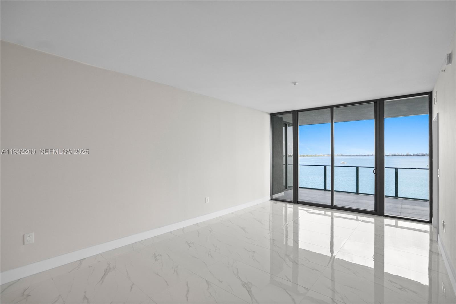 700 Northeast 24th Street, Unit 602 Miami, FL 33137 - Photo 23 of 39 a view of an empty room with a window