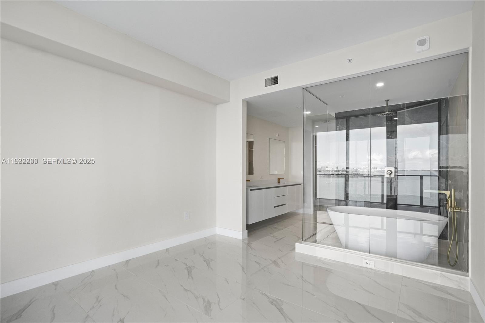 700 Northeast 24th Street, Unit 602 Miami, FL 33137 - Photo 27 of 39 a large white room with a large window