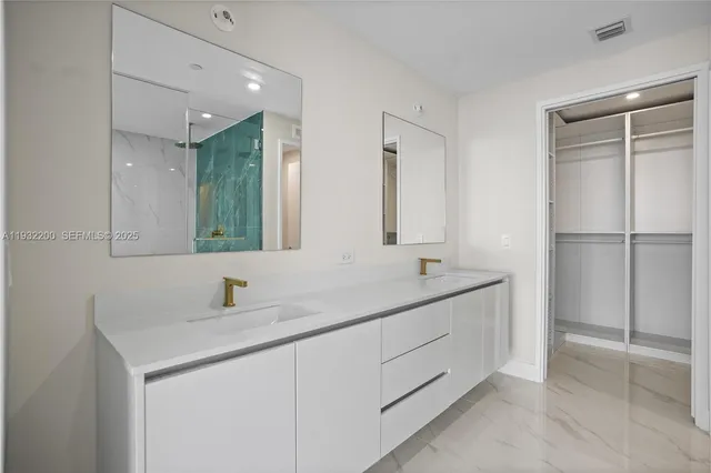 a bedroom with a bed and a mirror