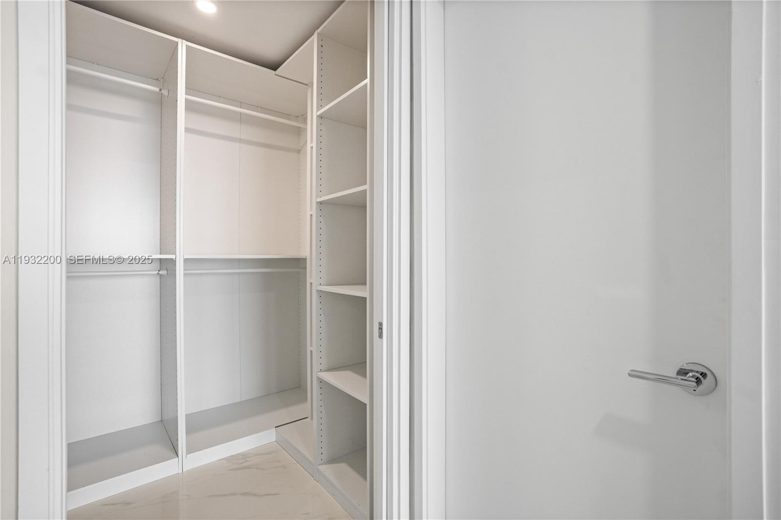 700 Northeast 24th Street, Unit 602 Miami, FL 33137 - Photo 34 of 39 a view of walk in closet with empty racks