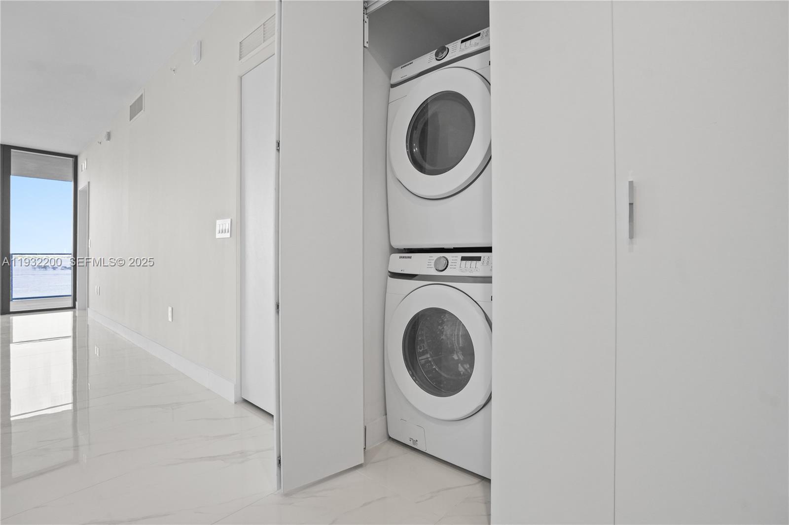 700 Northeast 24th Street, Unit 602 Miami, FL 33137 - Photo 38 of 39 a utility room with dryer and washer