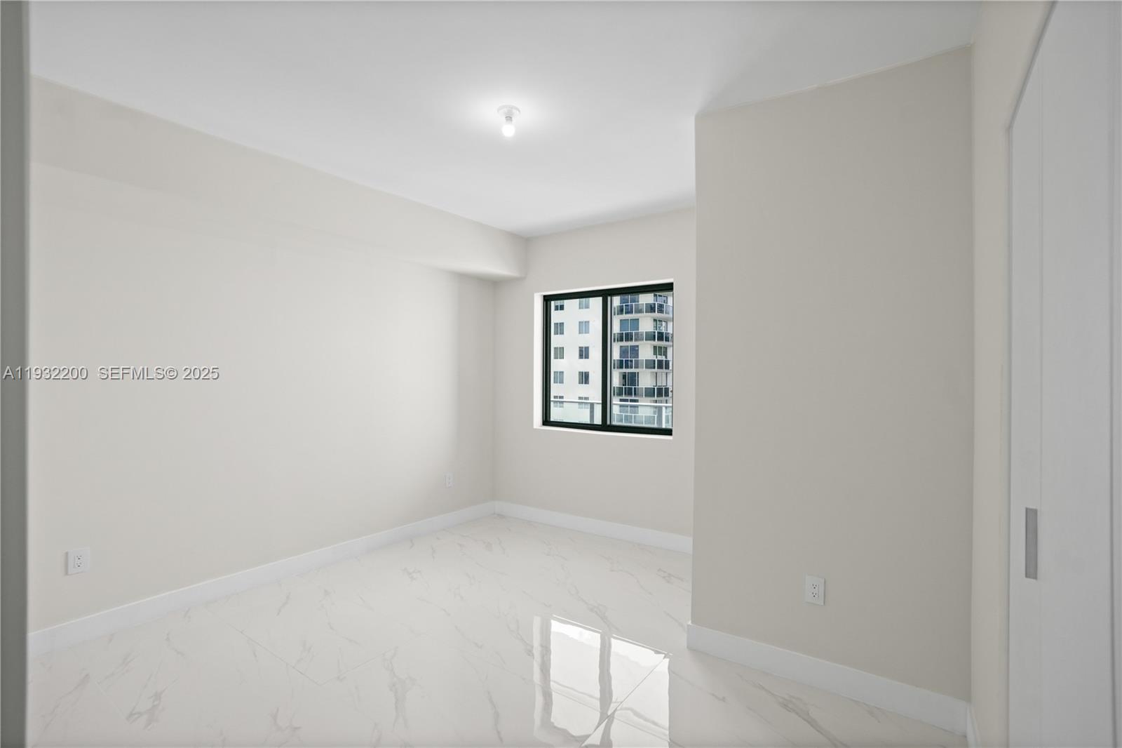 700 Northeast 24th Street, Unit 602 Miami, FL 33137 - Photo 10 of 39 an empty room with windows