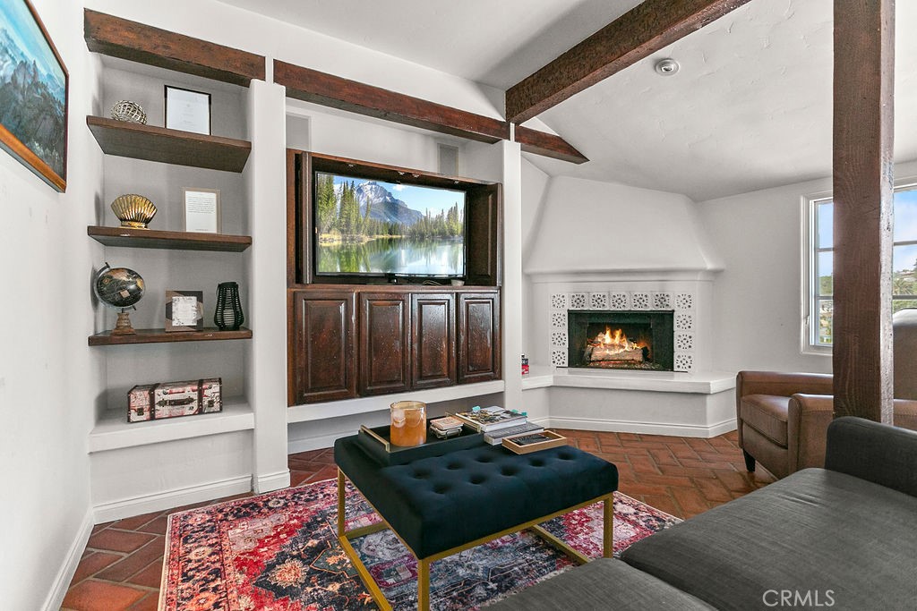 52 Emerald Bay Laguna Beach, CA 92651 - Photo 12 of 31 a living room with furniture and a flat screen tv