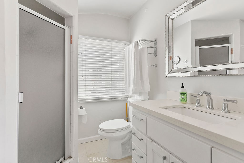 52 Emerald Bay Laguna Beach, CA 92651 - Photo 25 of 31 a bathroom with a sink a toilet a vanity and mirror