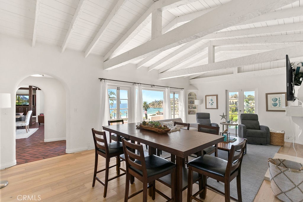 52 Emerald Bay Laguna Beach, CA 92651 - Photo 7 of 31 a view of a dining room with furniture window and wooden floor