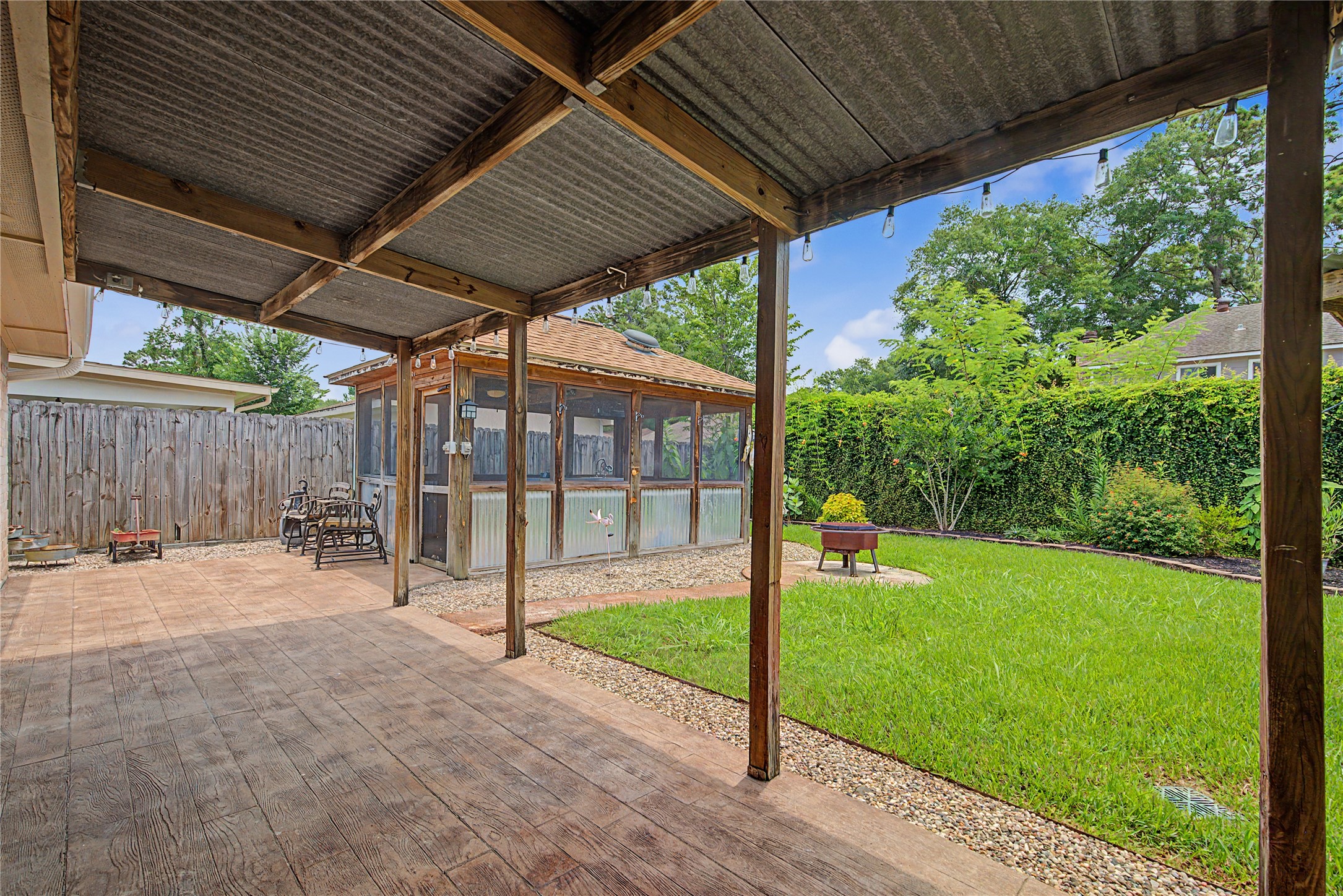 4210 Mossygate Drive Spring, TX 77373 - Photo 28 of 33 Large covered patio with additional covered screened outdoor living space in the background — great for relaxing or entertaining outdoors.