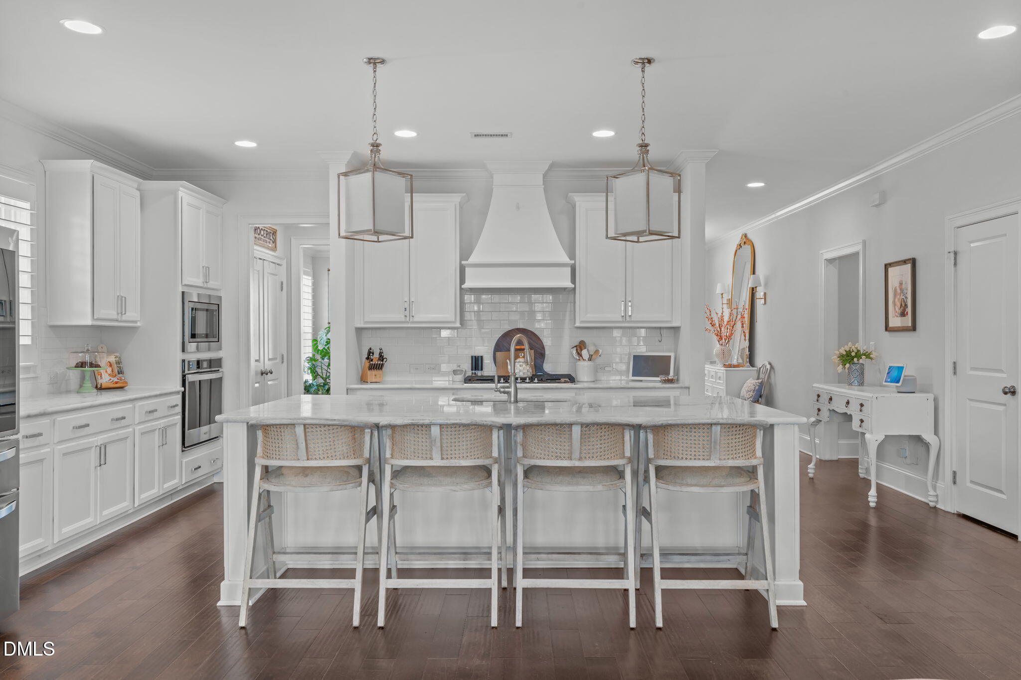 4144 Olde Judd Drive Willow Spring, NC 27592 - Photo 7 of 52 a kitchen with kitchen island granite countertop a table and chairs in it