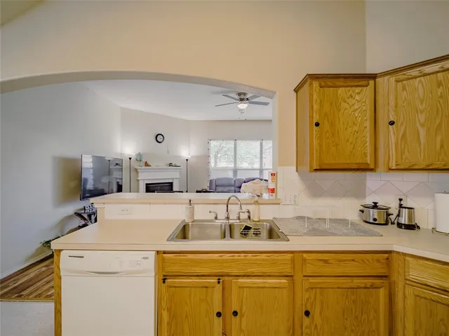 a kitchen with a sink and cabinets