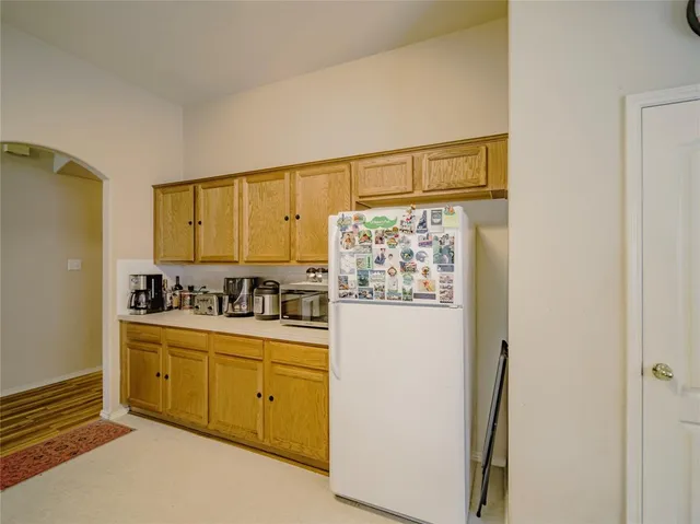 a view of a kitchen with electric appliances