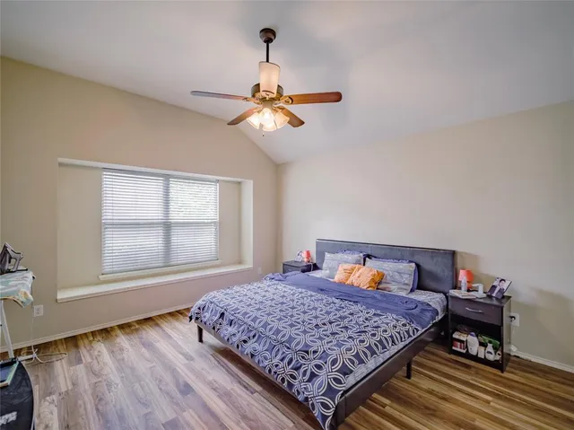 a bedroom with a bed and window