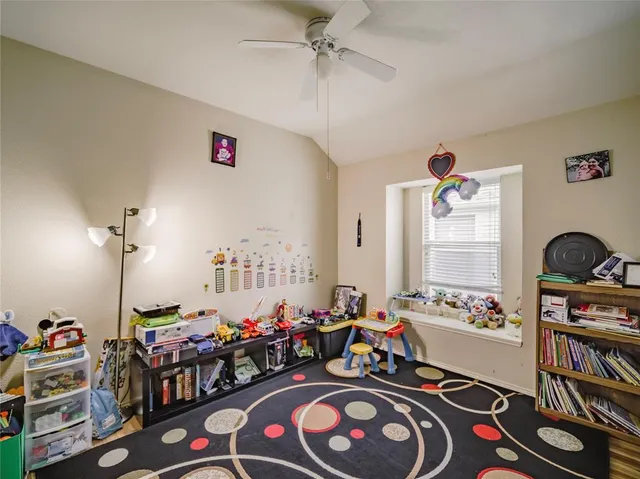 a living room with lots of furniture and decor