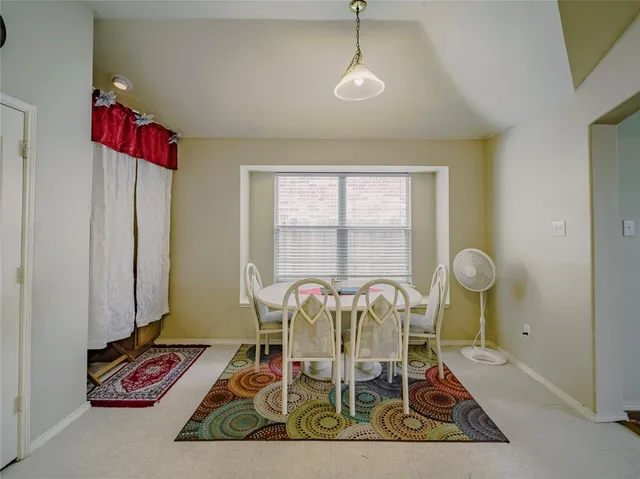 a view of a room with furniture and windows