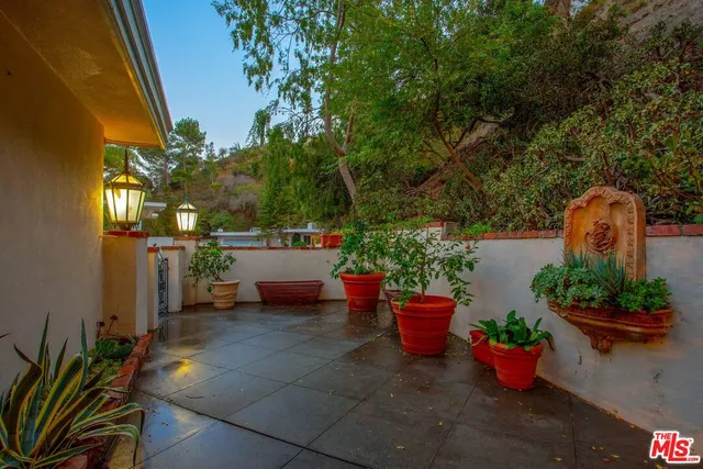 a view of a backyard with sitting area