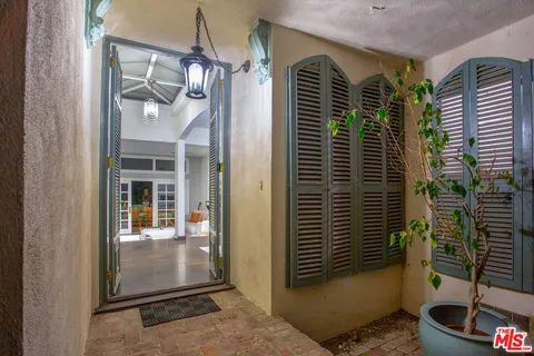 a view of a door and a window