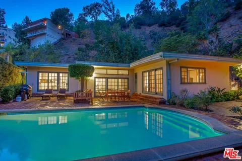 a front view of house with yard and seating area