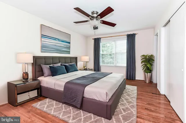 a bedroom with a large bed and a window