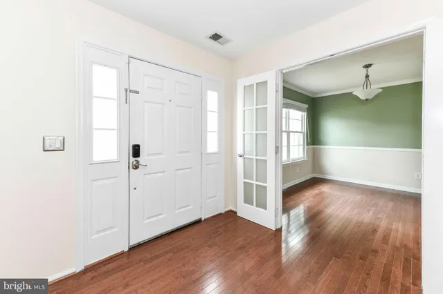 a view of entryway with wooden floor