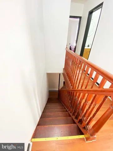 a bedroom with furniture and a wooden floor