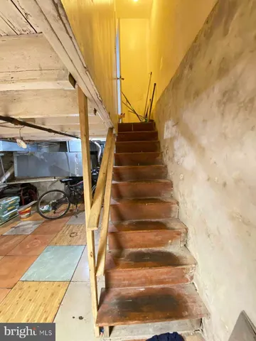 a view of a patio with couches chair and potted plants