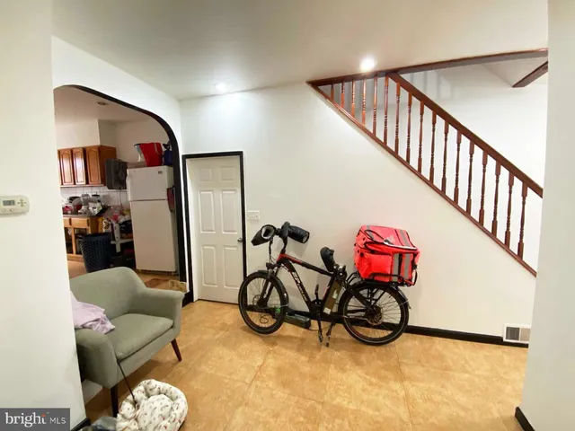 a kitchen with refrigerator and car