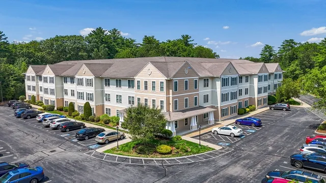 a view of a patio with swimming pool and sitting area