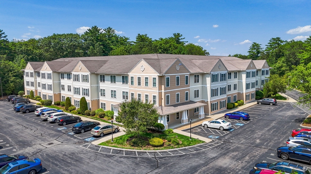 a view of a patio with swimming pool and sitting area