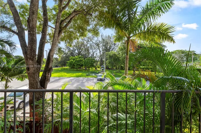 a view of a yard with a tree