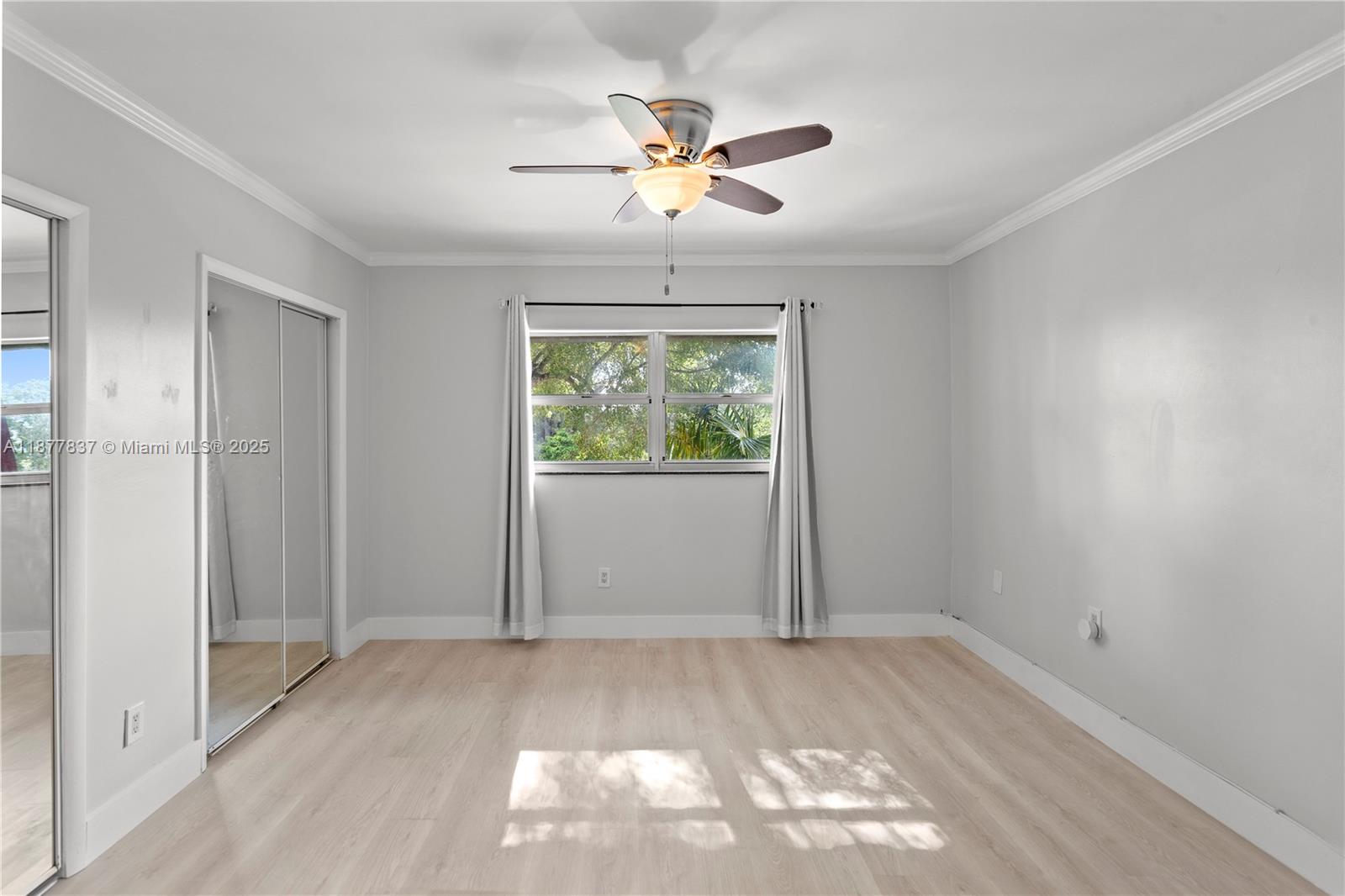 8600 Southwest 67th Avenue, Unit 937 Pinecrest, FL 33156 - Photo 13 of 24 an empty room with fan and windows