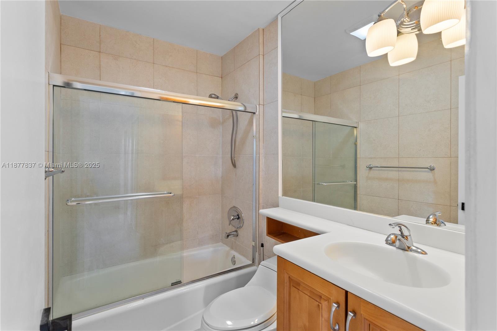 8600 Southwest 67th Avenue, Unit 937 Pinecrest, FL 33156 - Photo 16 of 24 a bathroom with a sink toilet and shower