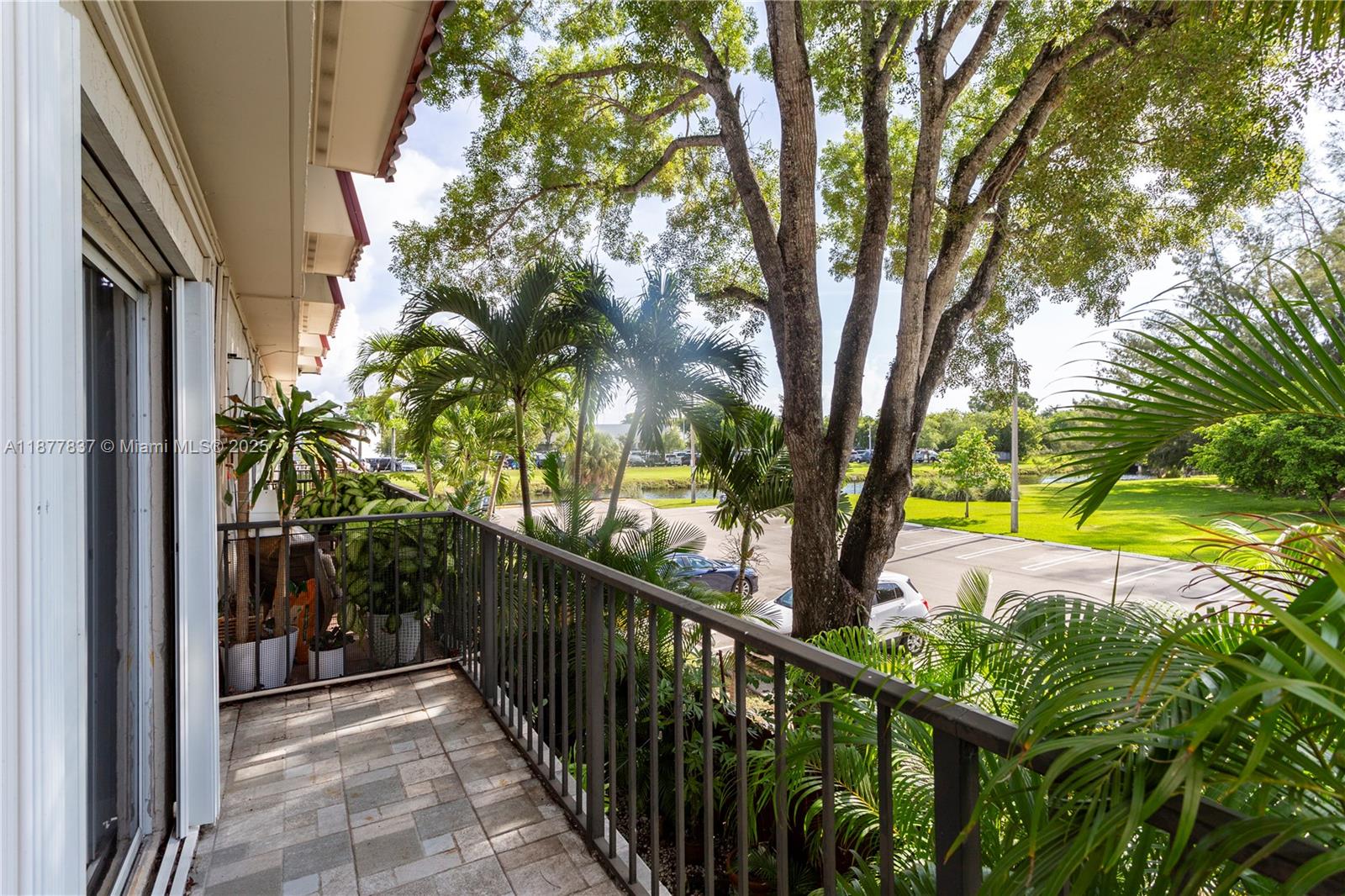 8600 Southwest 67th Avenue, Unit 937 Pinecrest, FL 33156 - Photo 22 of 24 a view of swimming pool from a balcony