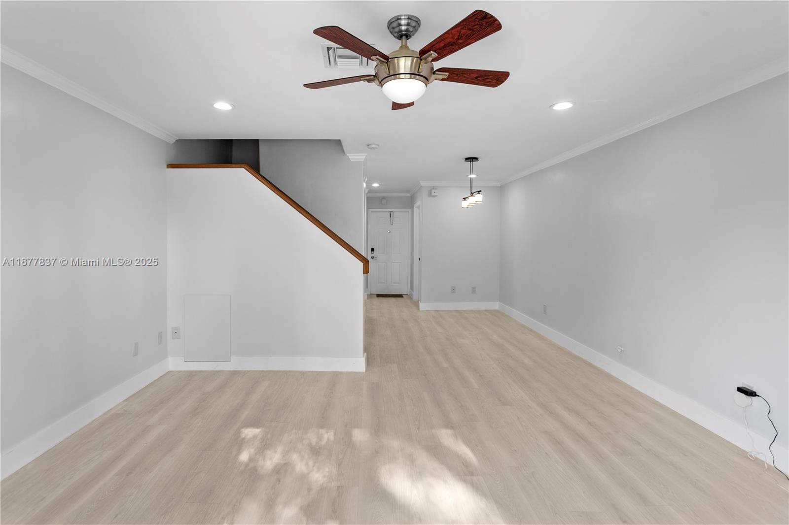 8600 Southwest 67th Avenue, Unit 937 Pinecrest, FL 33156 - Photo 4 of 24 wooden floor in an empty room with a ceiling fan