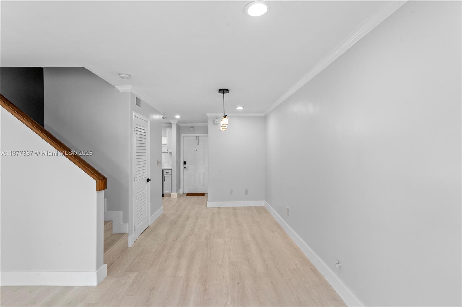 8600 Southwest 67th Avenue, Unit 937 Pinecrest, FL 33156 - Photo 5 of 24 a view of a big room with wooden floor and windows