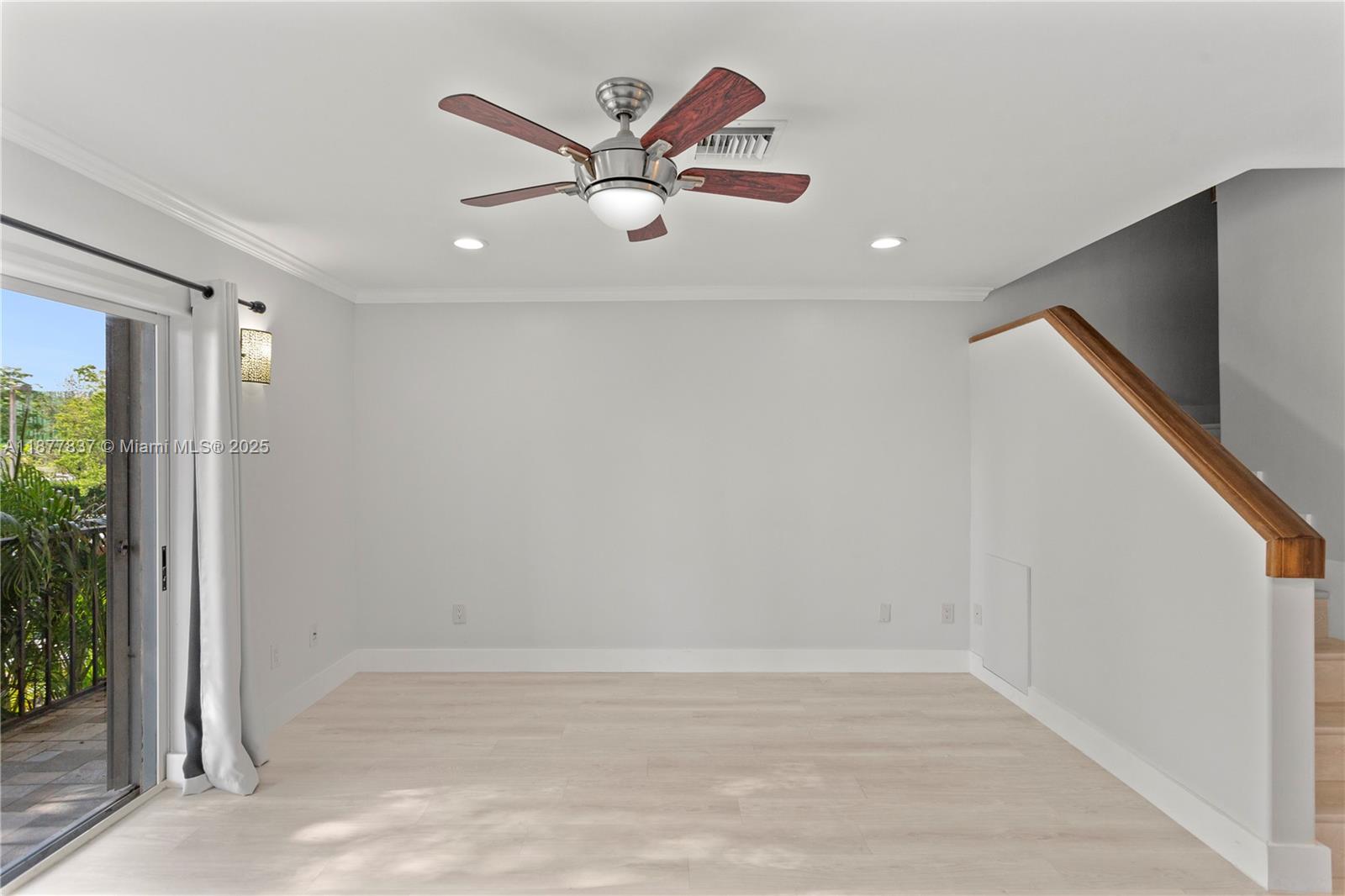 8600 Southwest 67th Avenue, Unit 937 Pinecrest, FL 33156 - Photo 6 of 24 an empty room with wooden floor and windows