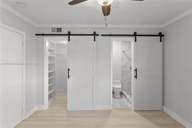 a bathroom with a shower and toilet