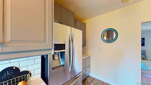 a kitchen with a refrigerator and a stove