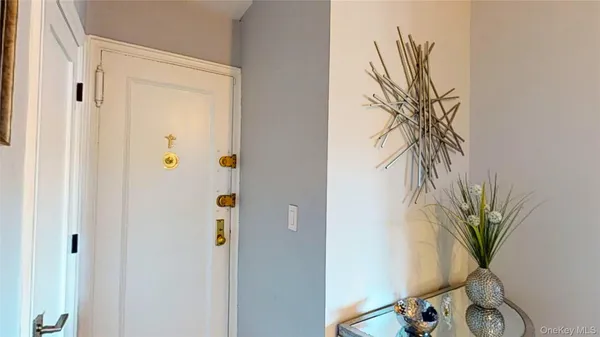 a view of a hallway with paintings on the wall