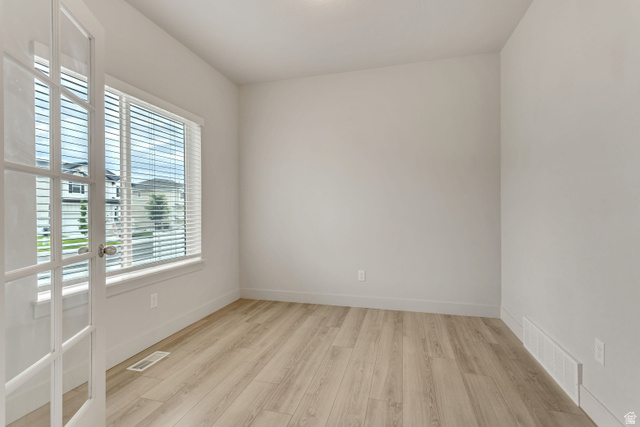 4572 Flower Point Eagle Mountain, UT 84005 - Photo 10 of 62 Room with light wood-finish flooring and white baseboards