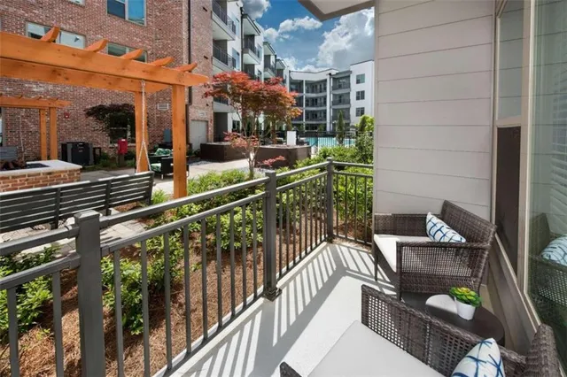 a view of a balcony with chairs