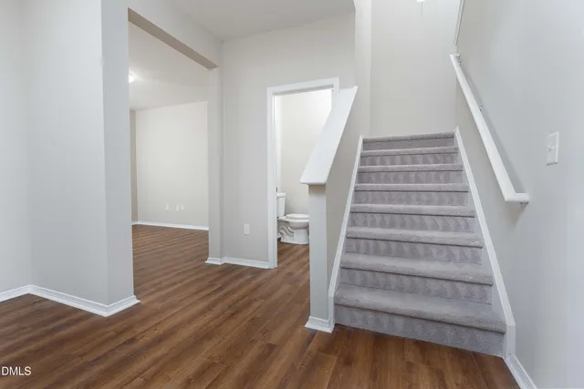 a view of an entryway with wooden floor